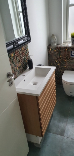 murer renovering af badeværelse fliser håndvask